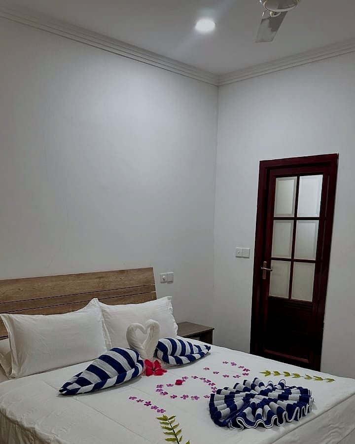 Family Room bed beside the ensuite bathroom door